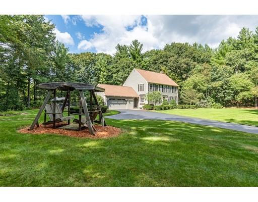 10 Matthew Road Littleton, MA 01460 - Photo 5 of 27 a view of a house with a yard porch and sitting area