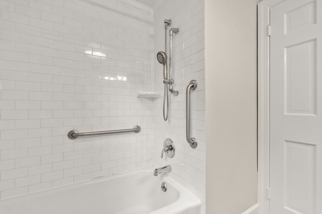 92 Abbot Street Andover, MA 01810 - Photo 23 of 35 a bathroom with a shower and a bathtub