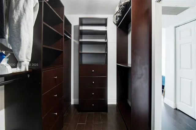 a view of closet area with empty racks