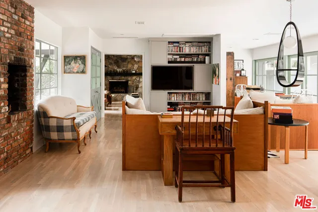 a bedroom with a bed and a table