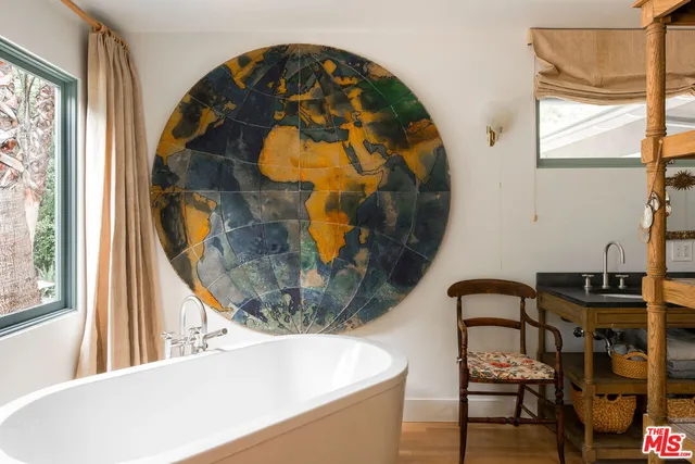 a view of hall way with furniture