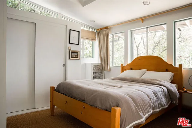a view of a chair and tables in the patio