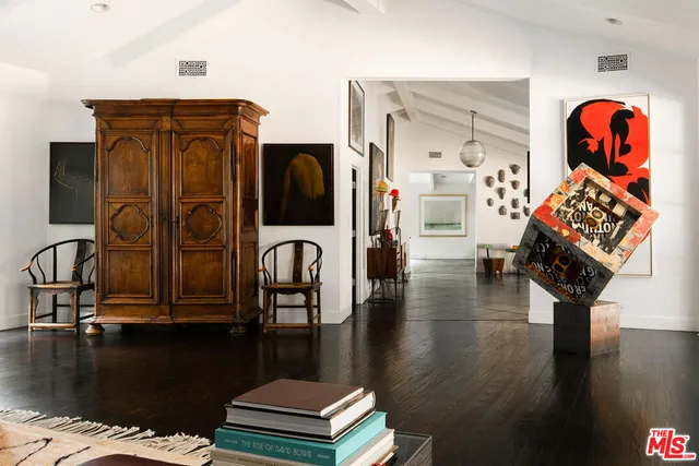 a kitchen with a table chairs and a dining table