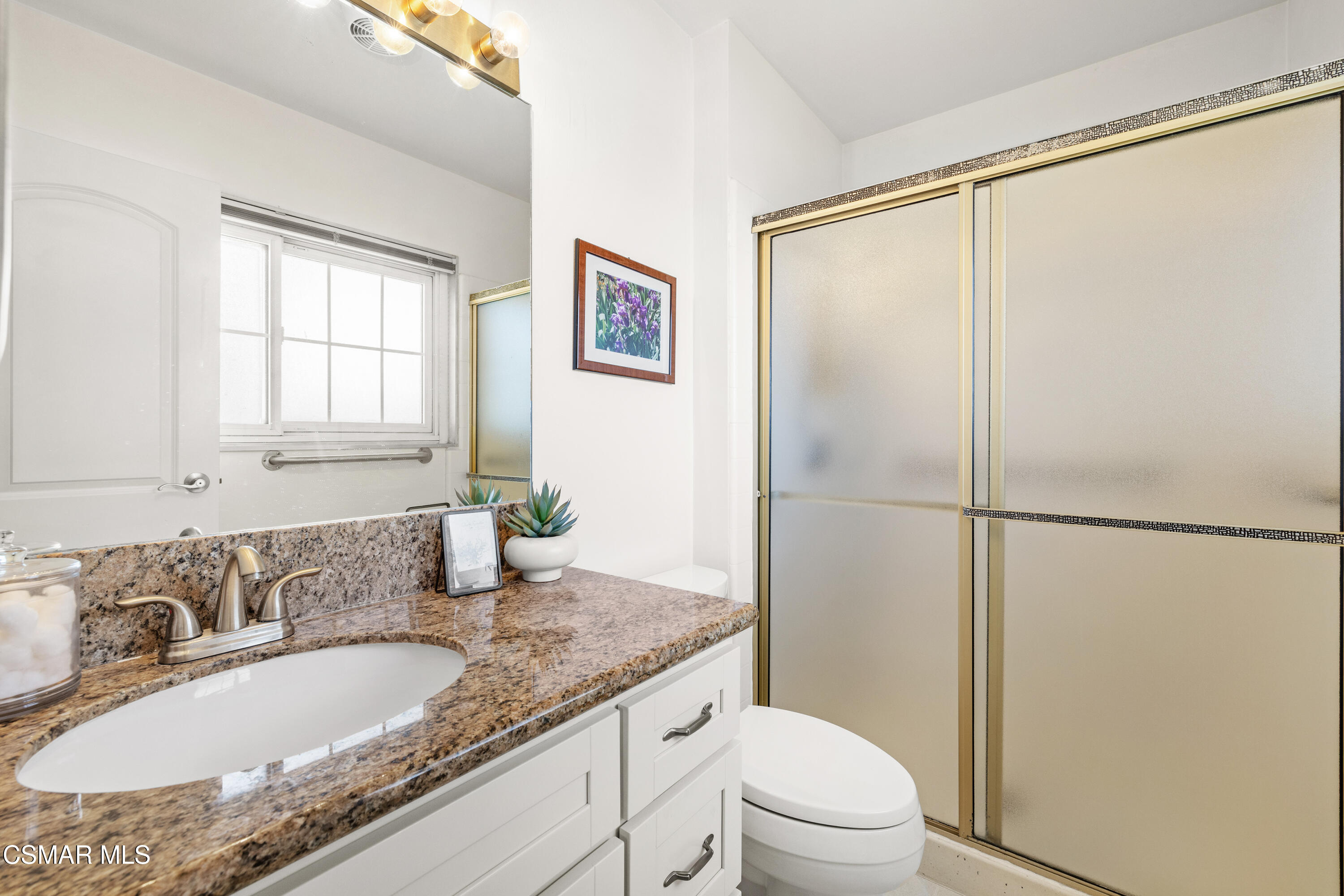 4477 Hempstead Street Simi Valley, CA 93063 - Photo 17 of 25 a bathroom with a granite countertop sink toilet and shower