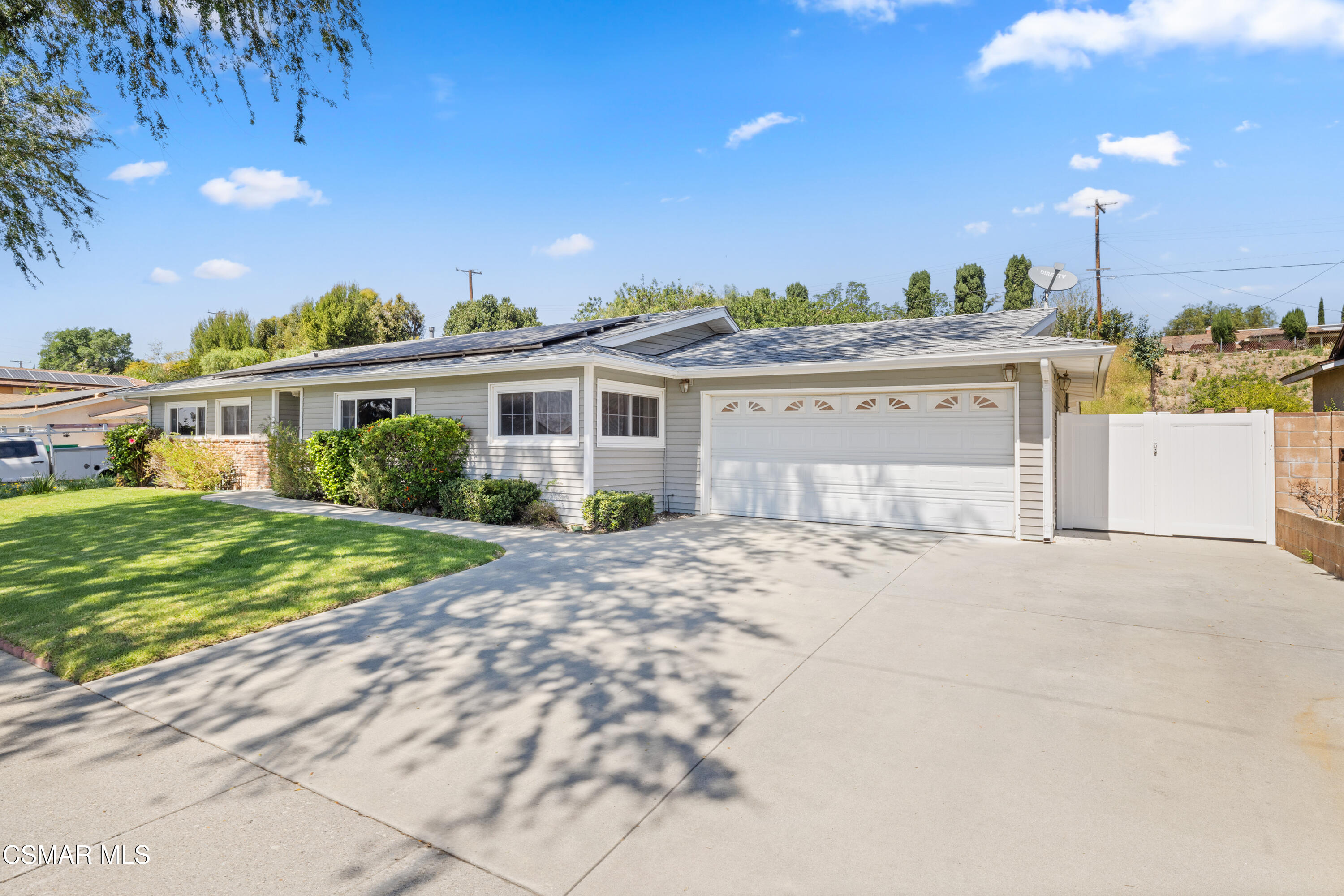 4477 Hempstead Street Simi Valley, CA 93063 - Photo 2 of 25 a front view of a house with a garden