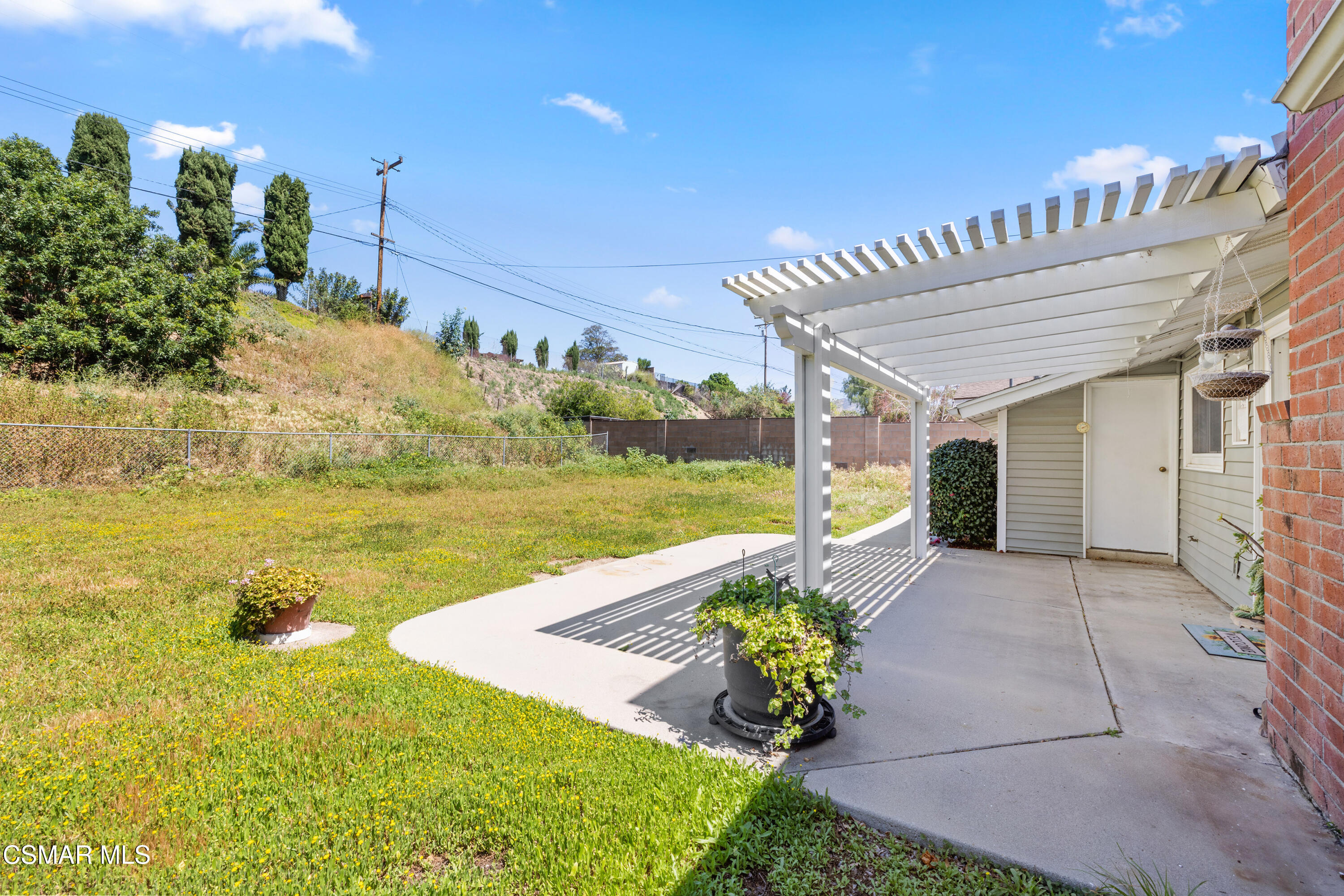 4477 Hempstead Street Simi Valley, CA 93063 - Photo 23 of 25 a front view of a house with a yard