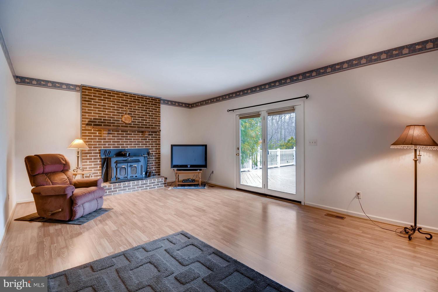 1519 Crestview Road Joppa, MD 21085 - Photo 14 of 28 Family Room w/new flooring and access to rear deck