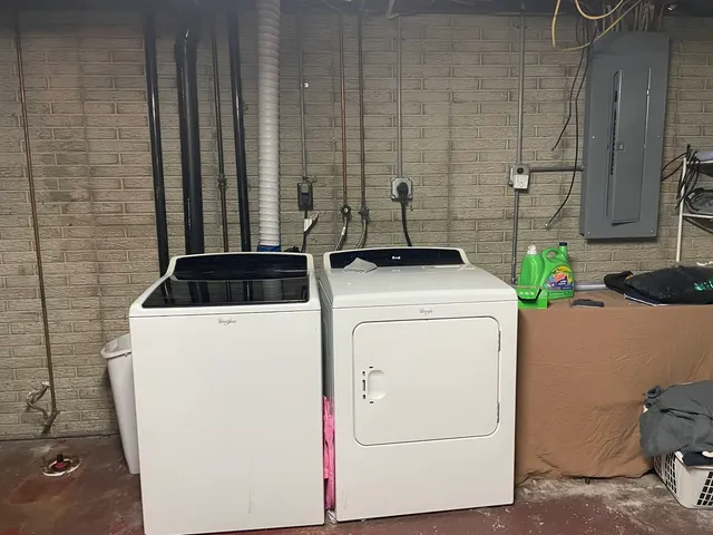a utility room with dryer and washer
