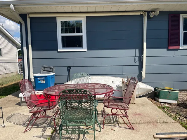 a patio with table and chairs