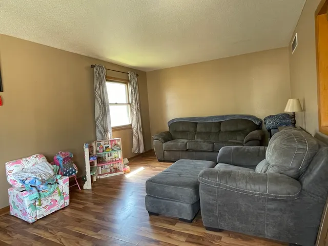 a living room with furniture and a couch