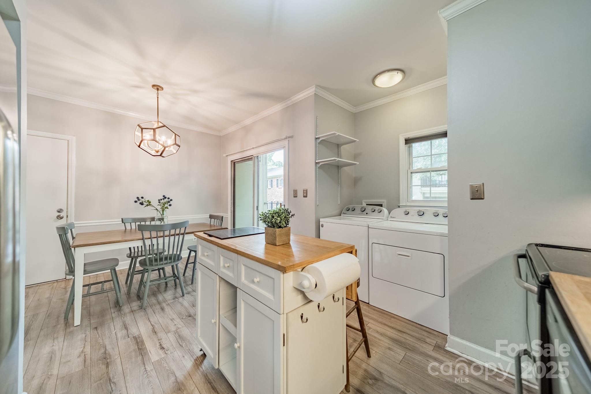 5927 Quail Hollow Road, Unit H Charlotte, NC 28210 - Photo 13 of 45 a kitchen with a sink stove and cabinets