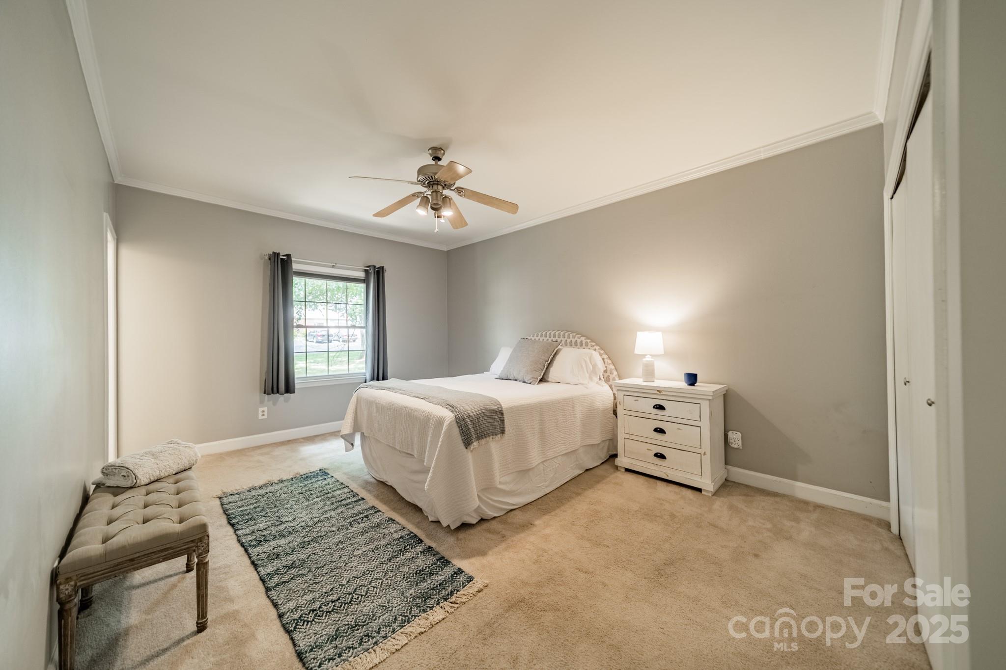 5927 Quail Hollow Road, Unit H Charlotte, NC 28210 - Photo 17 of 45 a bedroom with a bed and a window