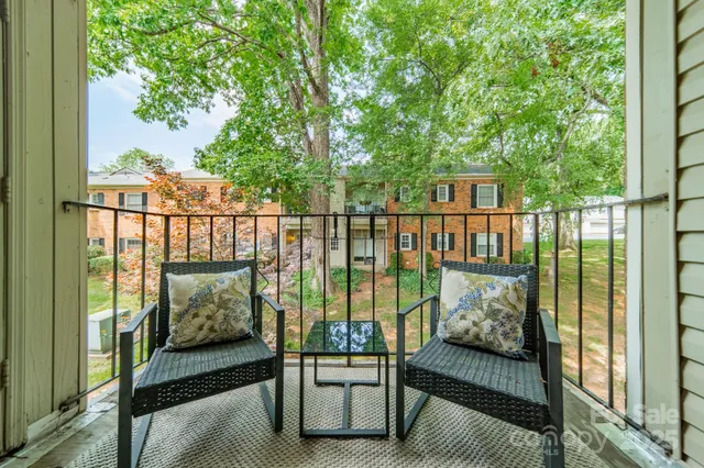 a balcony with furniture and city view