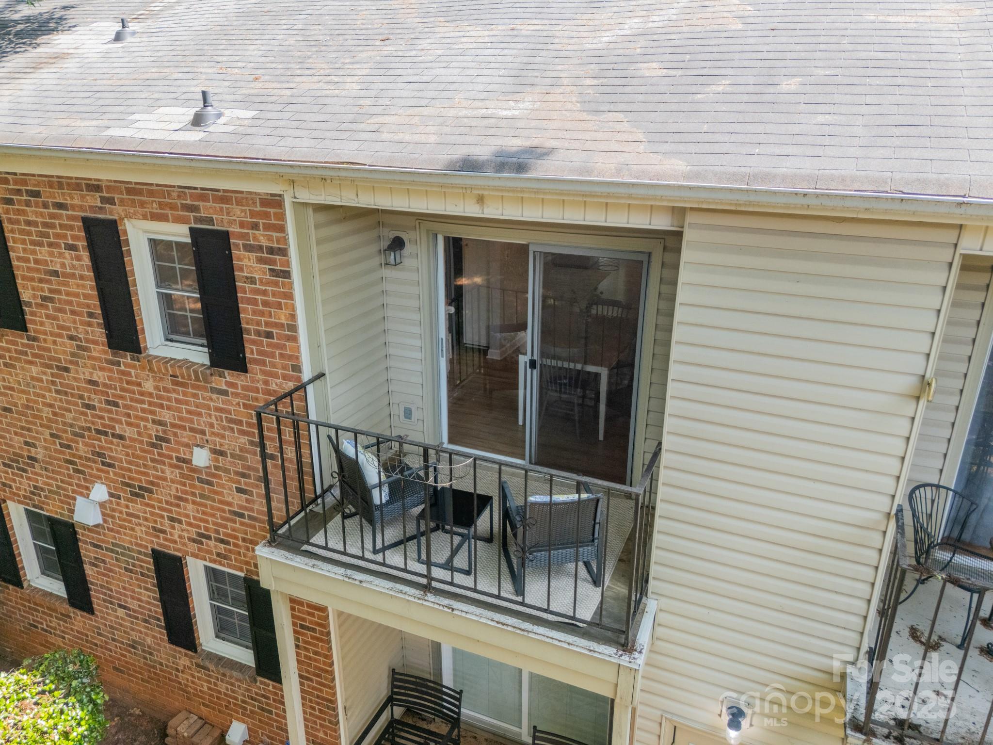 5927 Quail Hollow Road, Unit H Charlotte, NC 28210 - Photo 39 of 45 a front view of a house with chairs