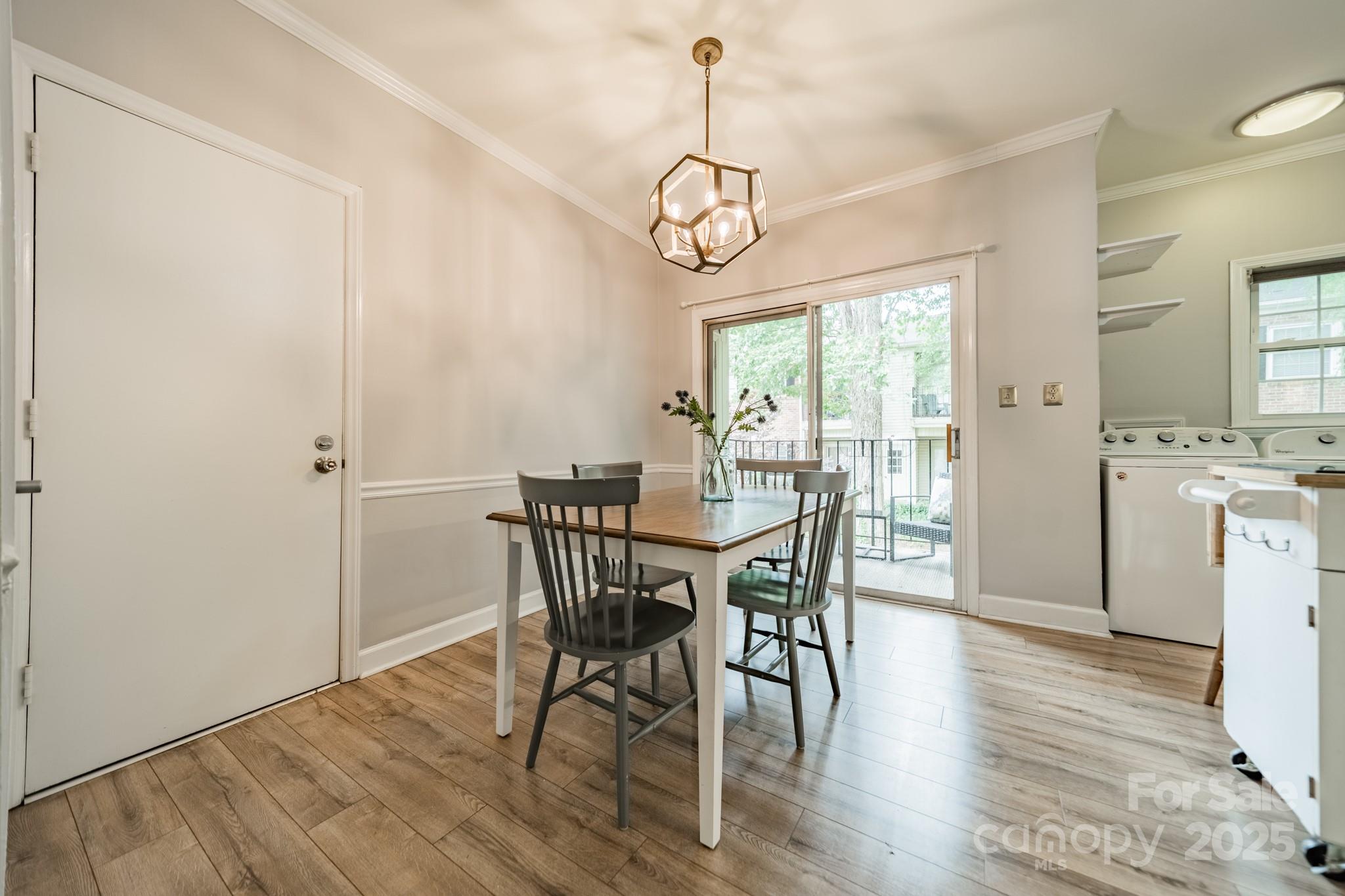 5927 Quail Hollow Road, Unit H Charlotte, NC 28210 - Photo 6 of 45 a view of a dining room with furniture window and wooden floor