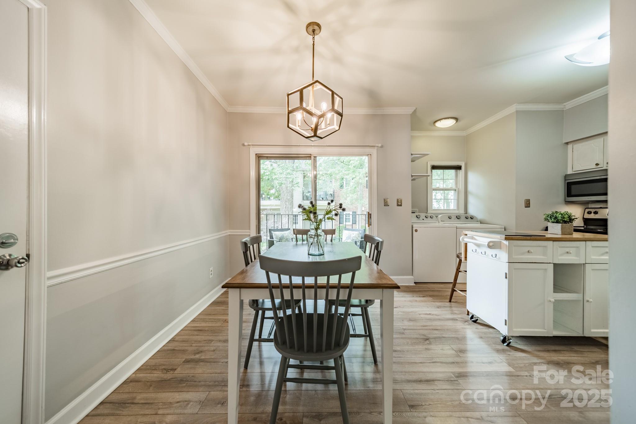 5927 Quail Hollow Road, Unit H Charlotte, NC 28210 - Photo 7 of 45 a view of a dining room with furniture window and wooden floor