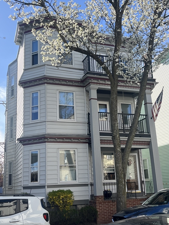 10 Antrim Street, Unit 2 Boston, MA 02128 - Photo 1 of 18 a view of a building with a garden