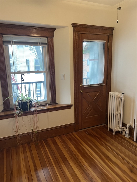 10 Antrim Street, Unit 2 Boston, MA 02128 - Photo 7 of 18 a room with a window and wooden floor