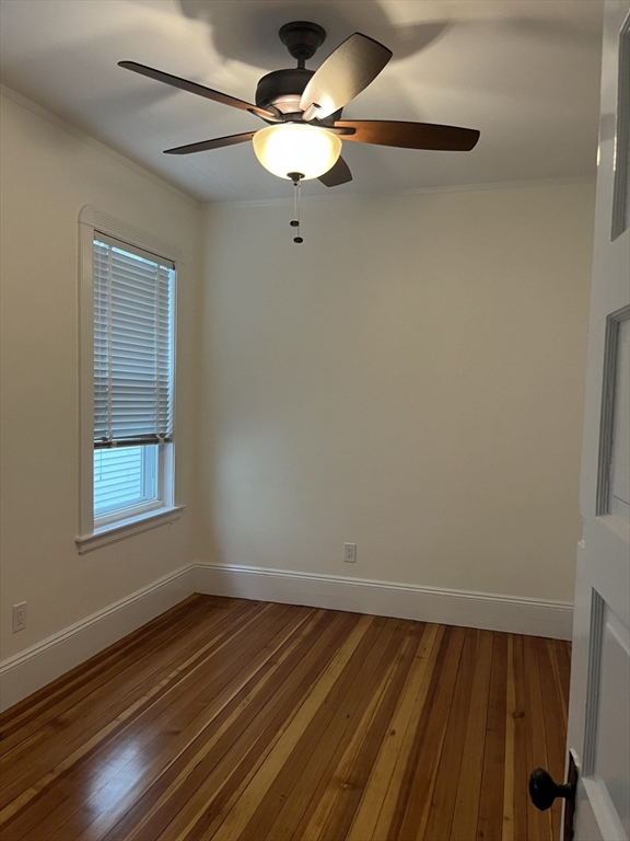 10 Antrim Street, Unit 2 Boston, MA 02128 - Photo 8 of 18 a view of an empty room with wooden floor and a window