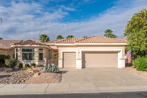 a front view of a house with a garage