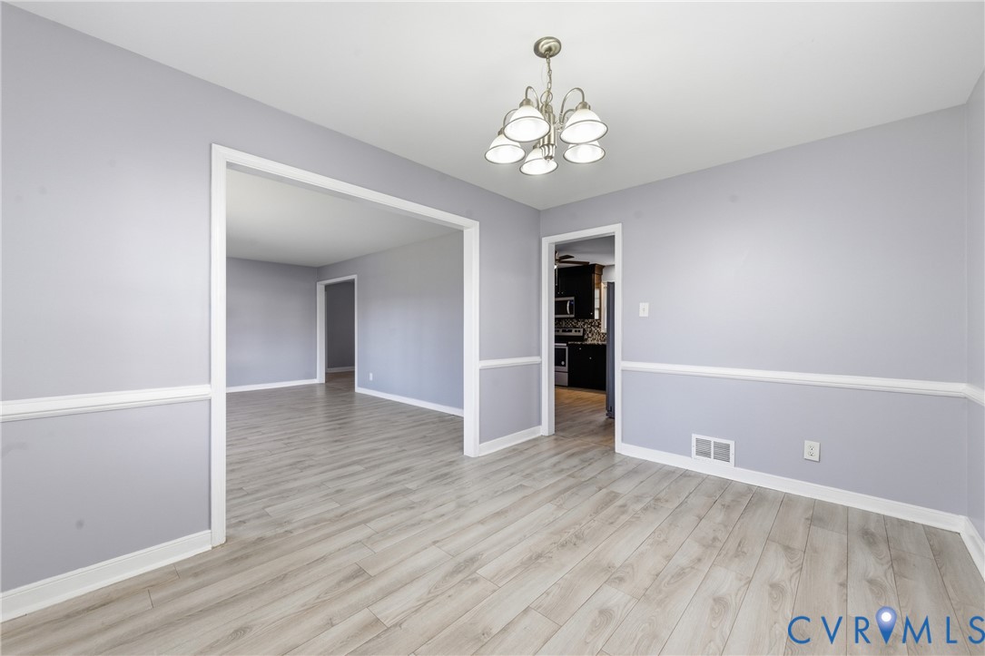 510 Jade Road North Chesterfield, VA 23236 - Photo 11 of 27 wooden floor in an empty room with a window