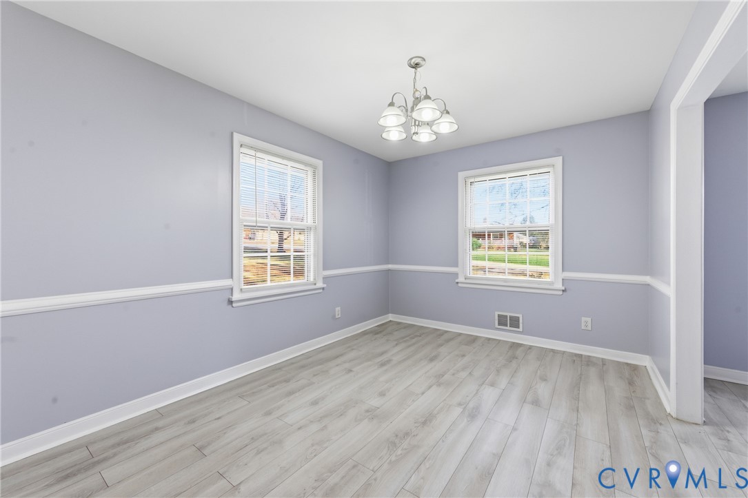 510 Jade Road North Chesterfield, VA 23236 - Photo 12 of 27 a view of an empty room with a window and wooden floor