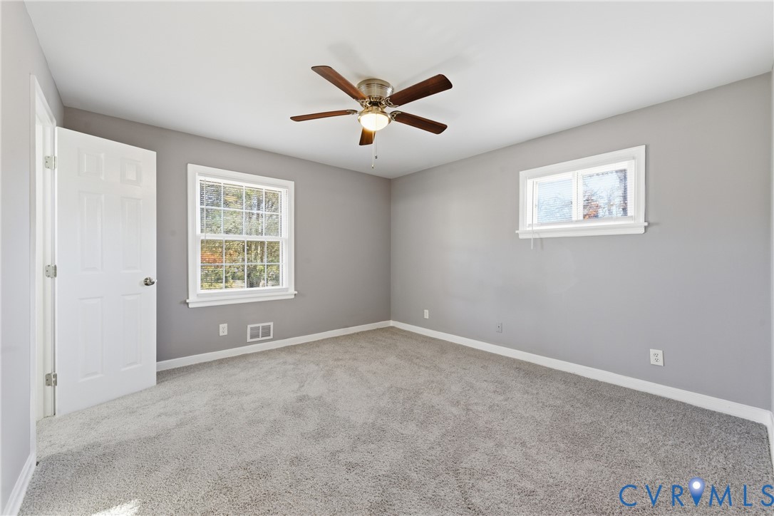 510 Jade Road North Chesterfield, VA 23236 - Photo 15 of 27 an empty room with window and ceiling fan