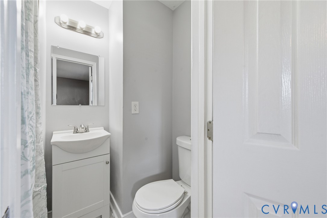 510 Jade Road North Chesterfield, VA 23236 - Photo 16 of 27 a bathroom with a sink a toilet and mirror