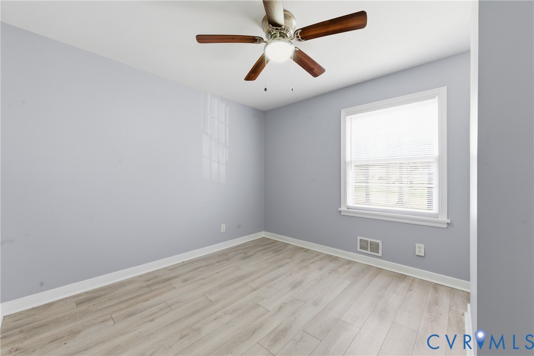 510 Jade Road North Chesterfield, VA 23236 - Photo 17 of 27 an empty room with a window and a ceiling fan