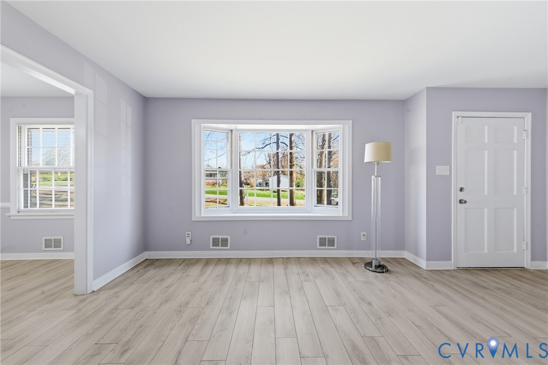 510 Jade Road North Chesterfield, VA 23236 - Photo 2 of 27 an empty room with wooden floor and windows
