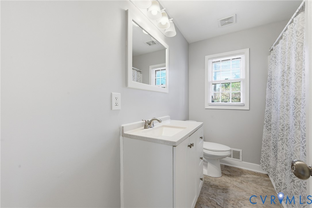 510 Jade Road North Chesterfield, VA 23236 - Photo 23 of 27 a bathroom with a sink toilet and mirror