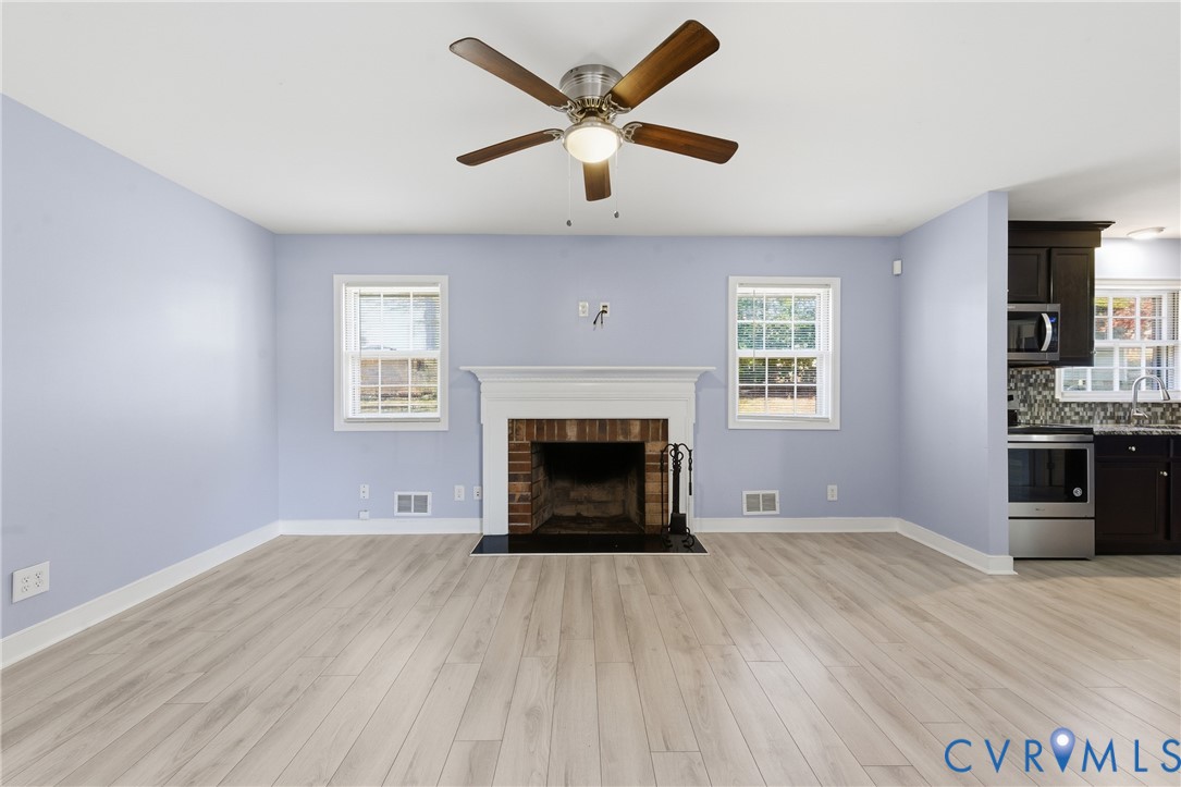 510 Jade Road North Chesterfield, VA 23236 - Photo 7 of 27 an empty room with windows and fireplace