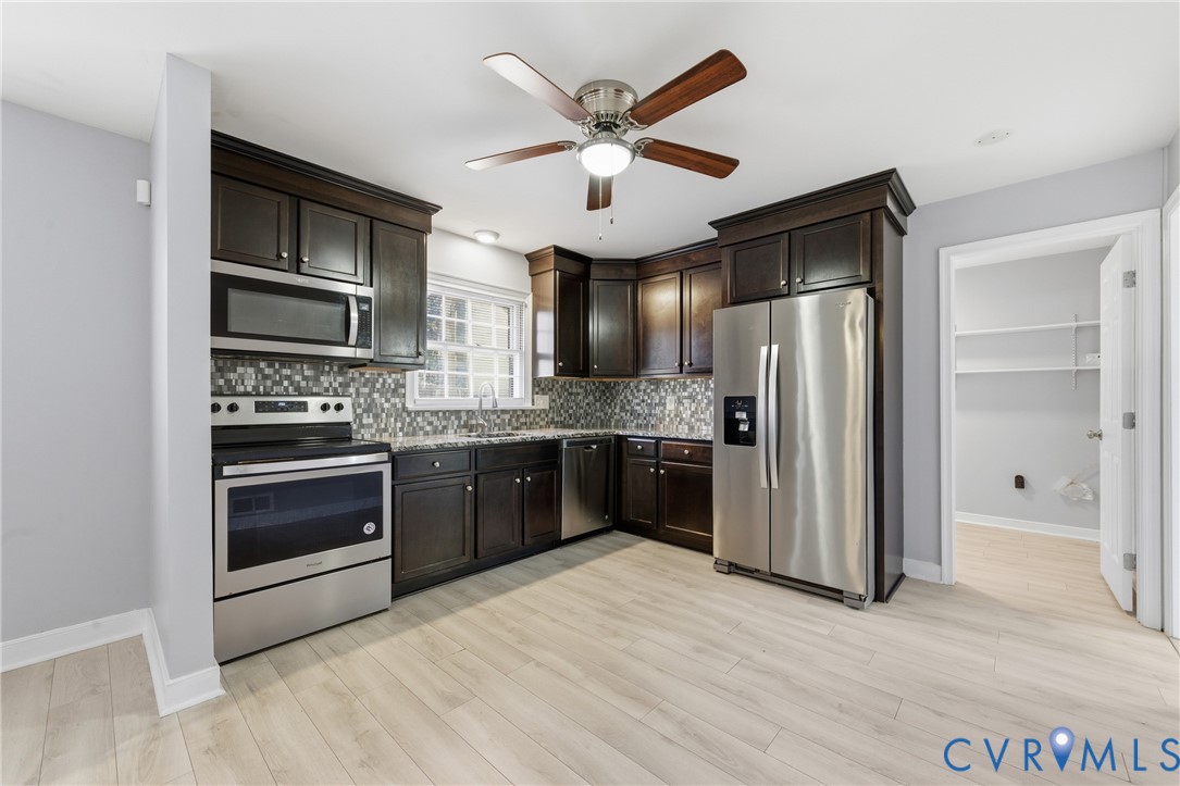 510 Jade Road North Chesterfield, VA 23236 - Photo 10 of 27 a kitchen with stainless steel appliances kitchen island granite countertop a refrigerator and a stove top oven