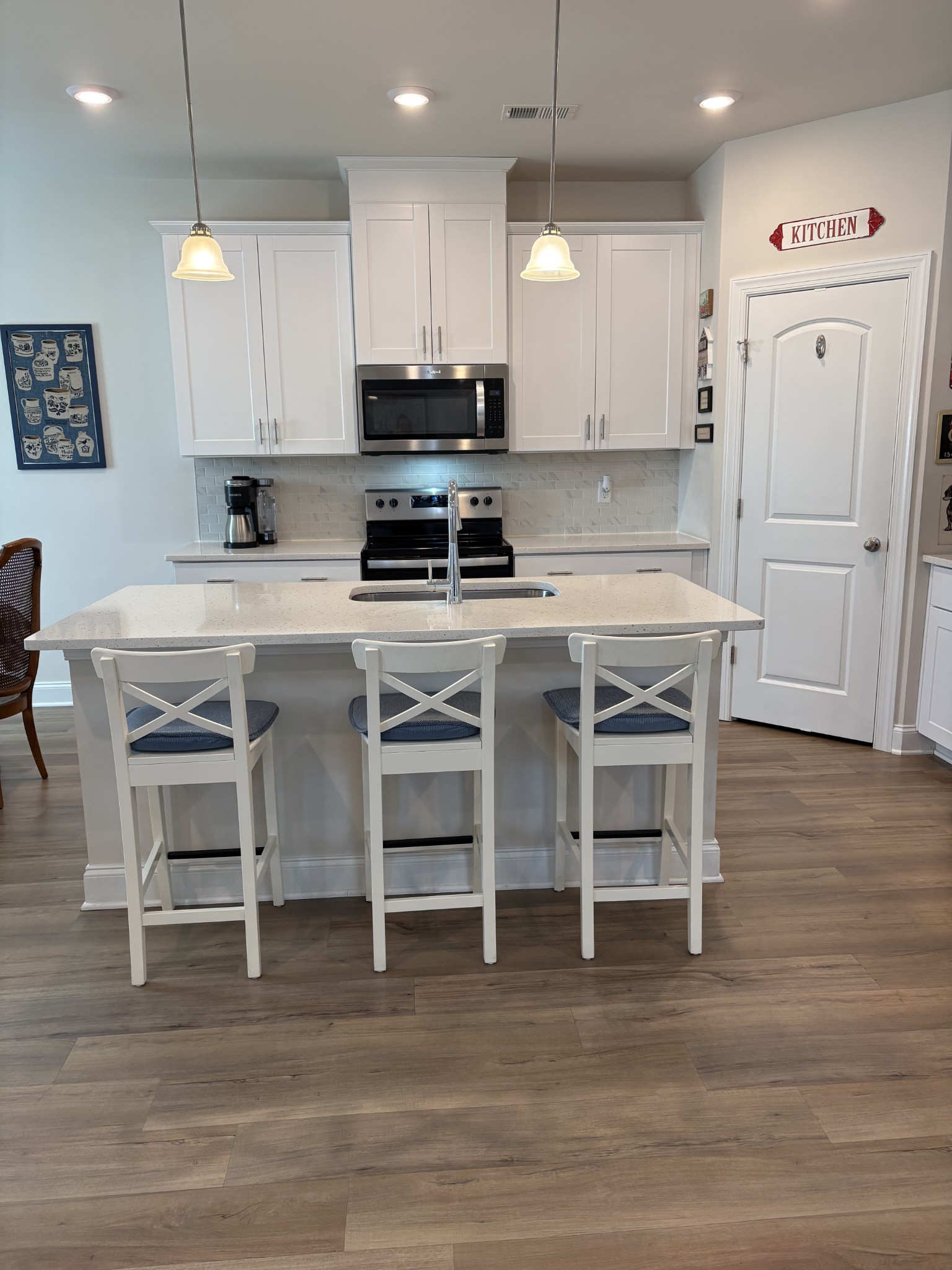 672 Taylor Bend Columbia, TN 38401 - Photo 9 of 32 a kitchen with stainless steel appliances a stove a table and chairs in it