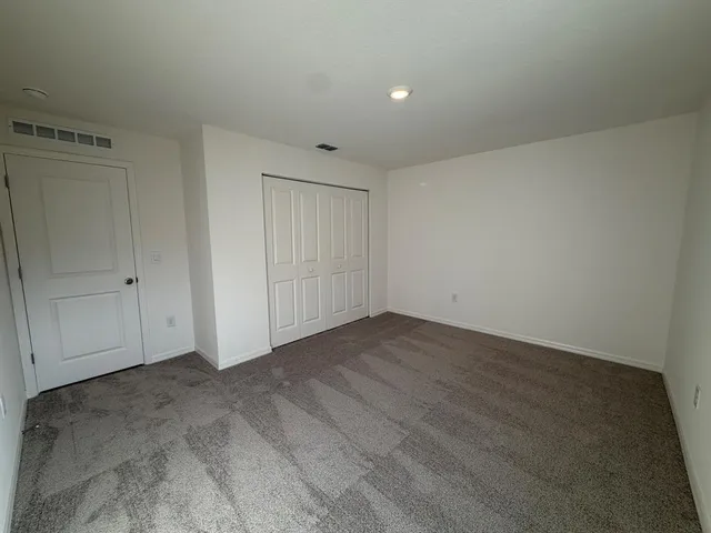 an empty room with a bench