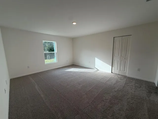 a table with chairs and a potted plant on it