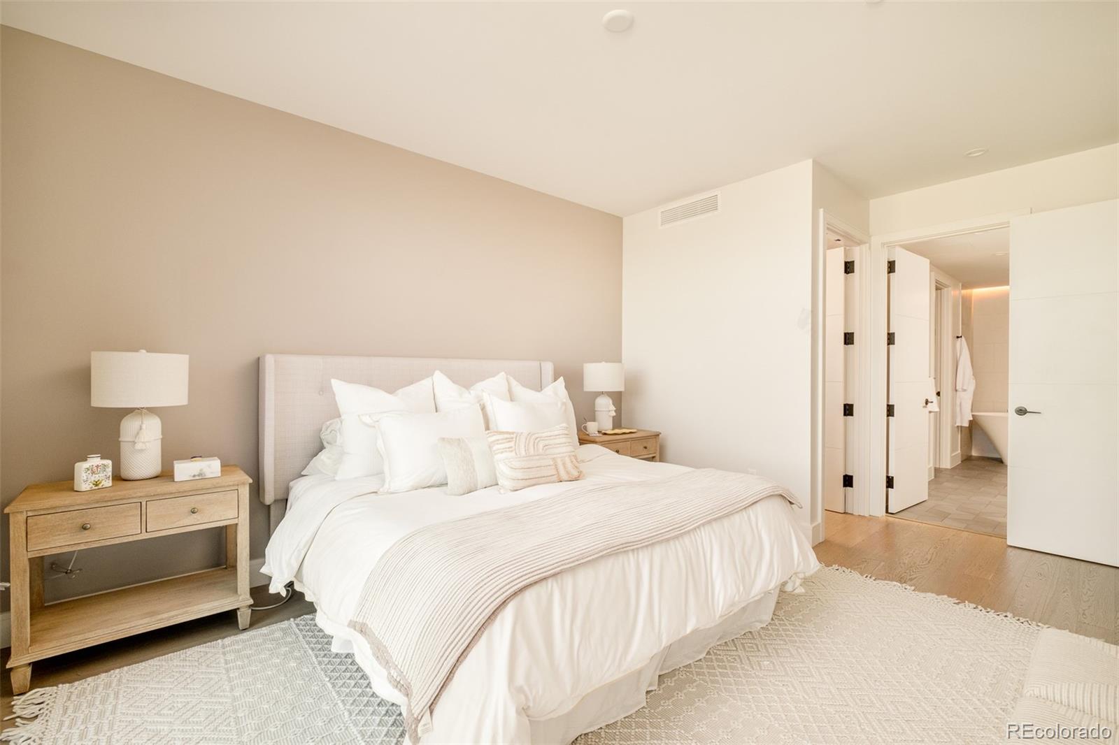 1901 Wazee Street, Unit 704 Denver, CO 80202 - Photo 13 of 49 a bedroom with bed and a dresser