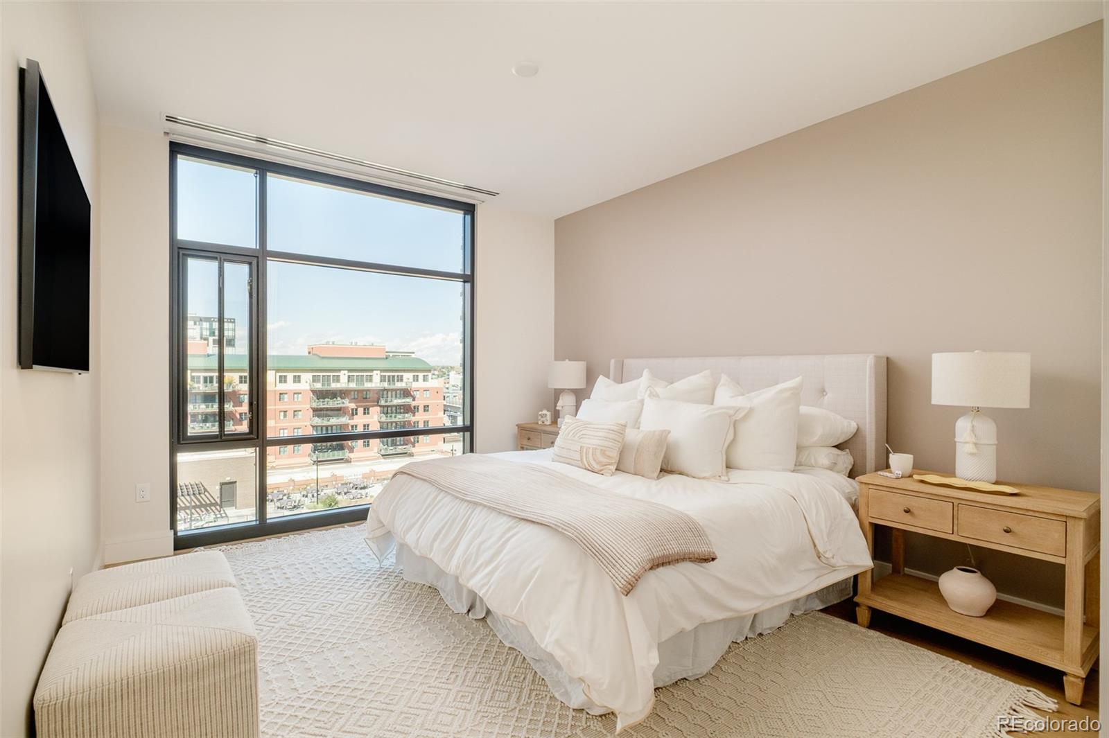 1901 Wazee Street, Unit 704 Denver, CO 80202 - Photo 14 of 49 a bedroom with a bed and a large window