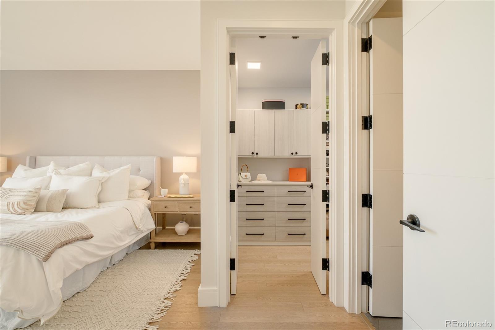 1901 Wazee Street, Unit 704 Denver, CO 80202 - Photo 21 of 49 a bedroom with a bed and a mirror