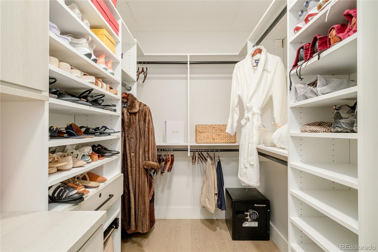 1901 Wazee Street, Unit 704 Denver, CO 80202 - Photo 22 of 49 a view of walk in closet with clothes and shoes