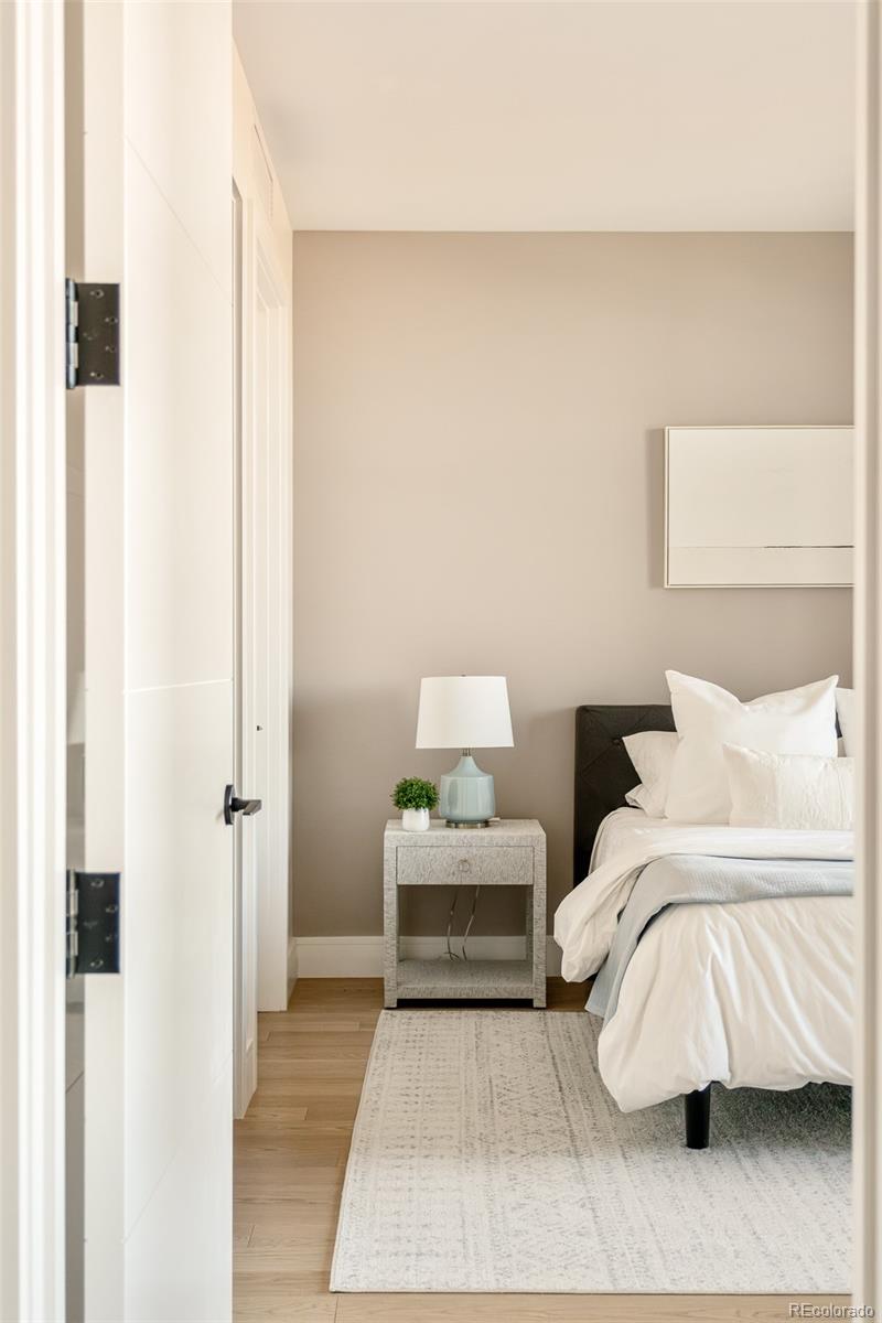 1901 Wazee Street, Unit 704 Denver, CO 80202 - Photo 23 of 49 a bedroom with a bed and a couch