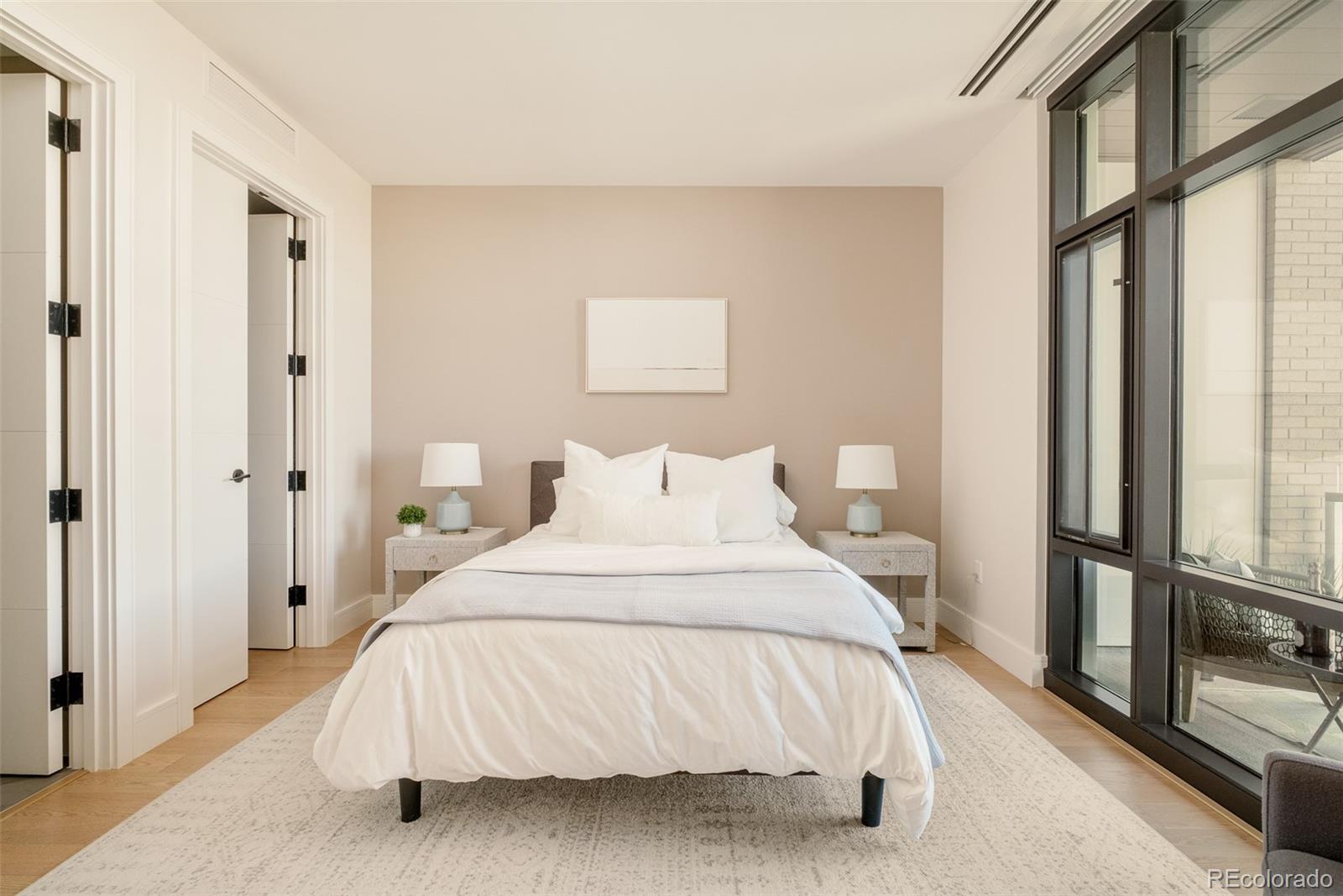 1901 Wazee Street, Unit 704 Denver, CO 80202 - Photo 24 of 49 a bedroom with a bed and a large window