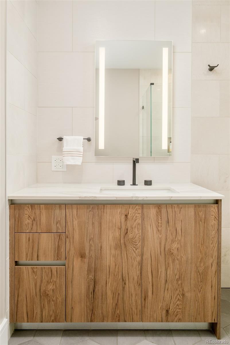 1901 Wazee Street, Unit 704 Denver, CO 80202 - Photo 25 of 49 a bathroom with a sink and a mirror