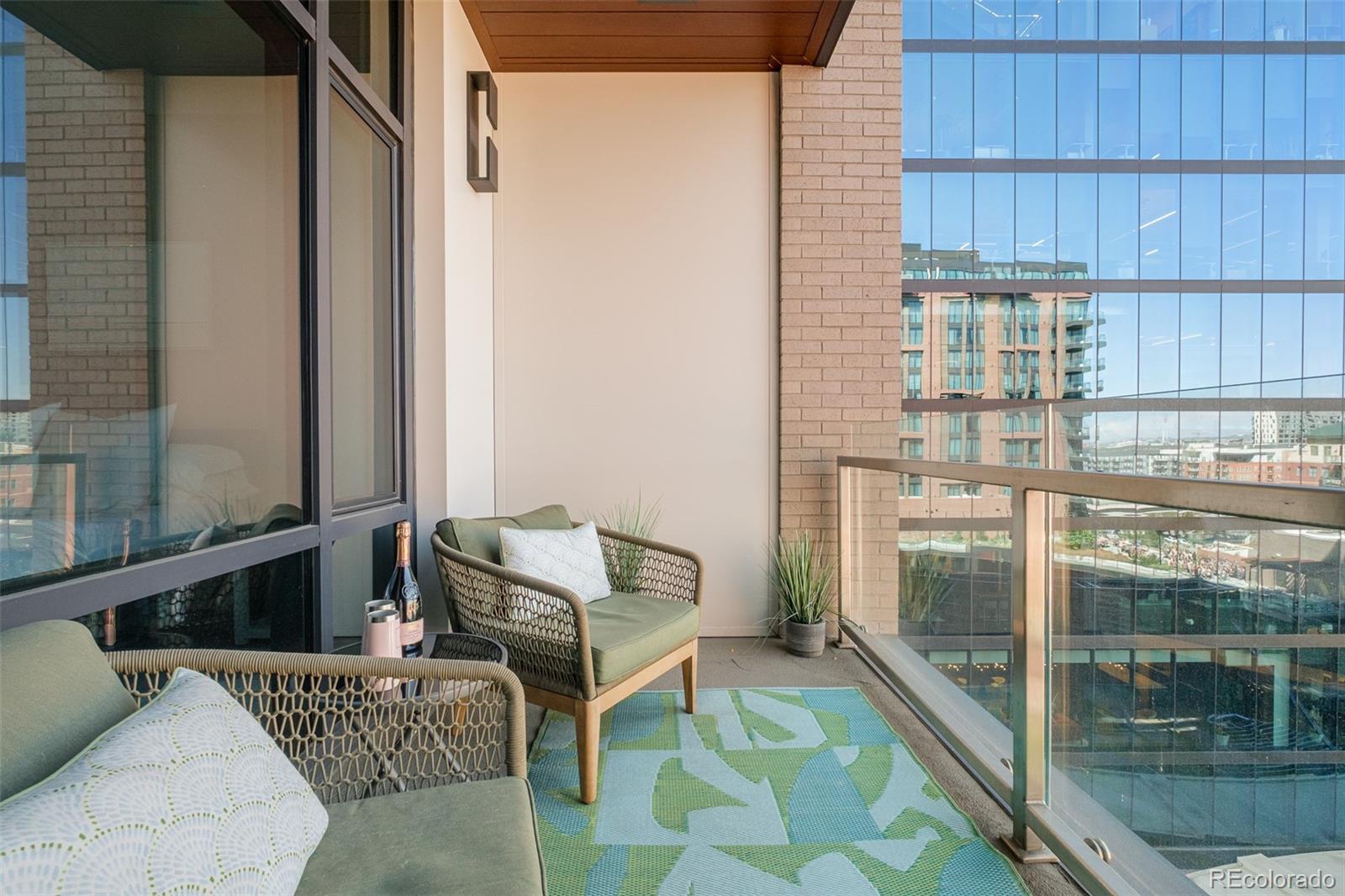 1901 Wazee Street, Unit 704 Denver, CO 80202 - Photo 29 of 49 a balcony with furniture and next to a window