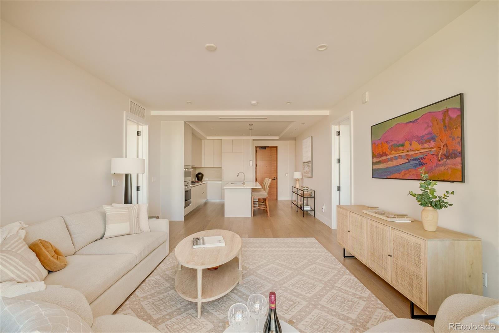 1901 Wazee Street, Unit 704 Denver, CO 80202 - Photo 8 of 49 a living room with furniture and a flat screen tv
