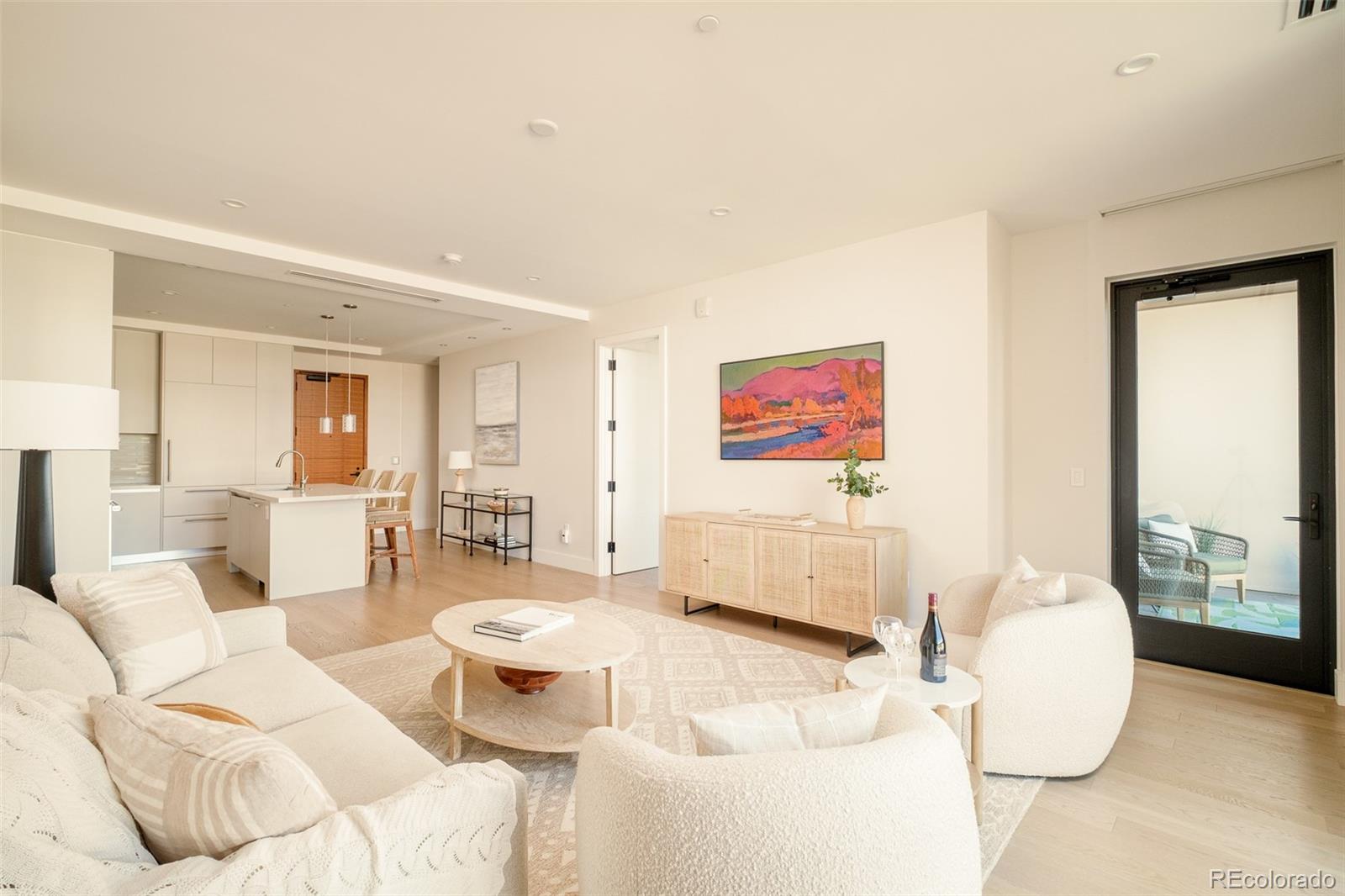 1901 Wazee Street, Unit 704 Denver, CO 80202 - Photo 10 of 49 a living room with furniture and a large window