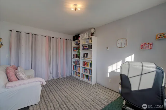 a bedroom with a bed and a couch