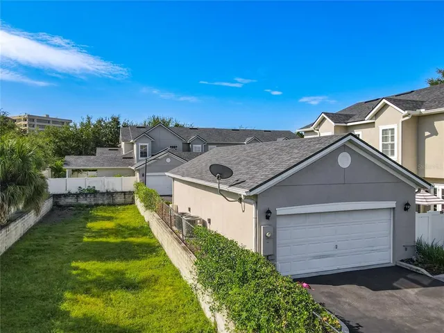 a aerial view of a house with a yard