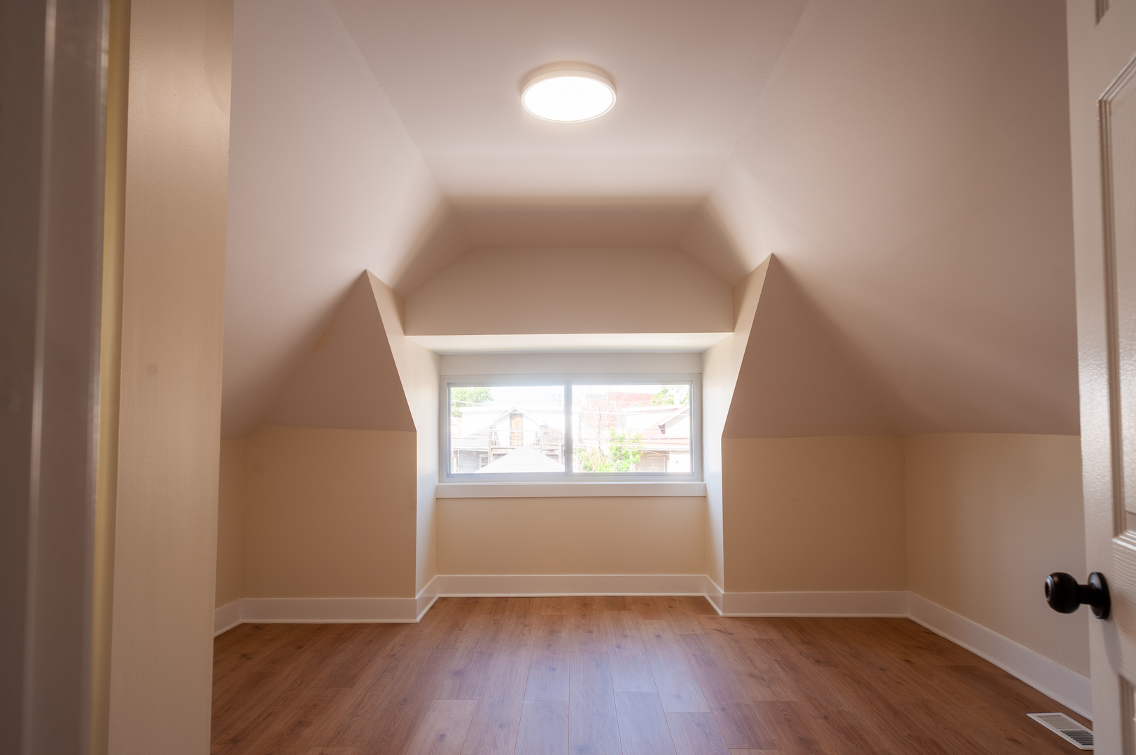 8620 South Union Avenue Chicago, IL 60620 - Photo 31 of 41 an empty room with wooden floor and windows