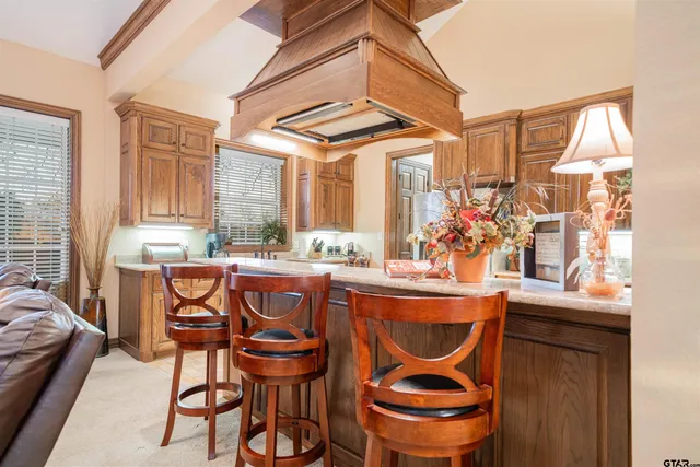 a dining area with furniture and window
